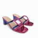 Mules with asymmetrical details in Fuchsia